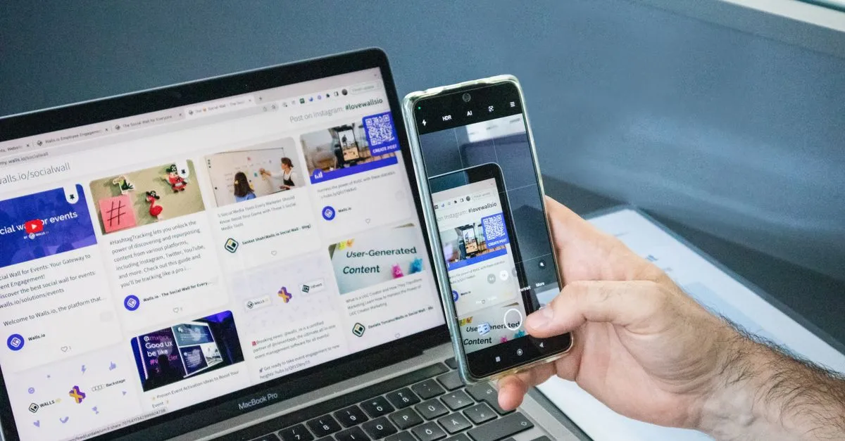 A smartphone and a laptop side by side showing the same web content.