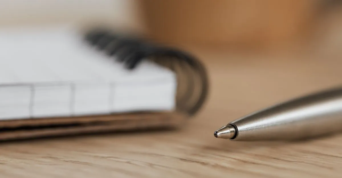 An open notebook and pen, representing well-structured content that AI search can quote.