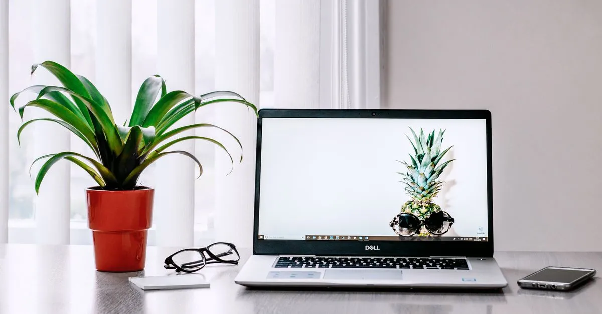 A tidy workspace with a laptop, where first-page rankings are earned over time.